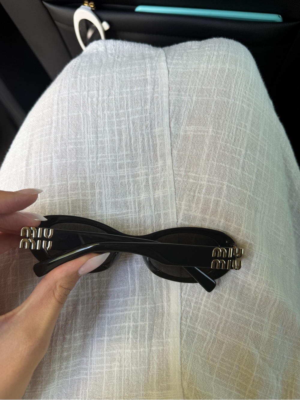 Miu Miu Black Oval Sunglasses - Picture 2 of 3